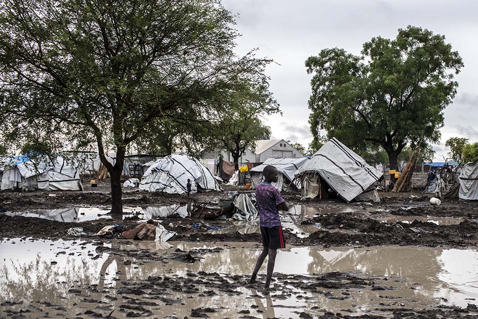 A boy stands in floodwater in Jonglei State, South Sudan