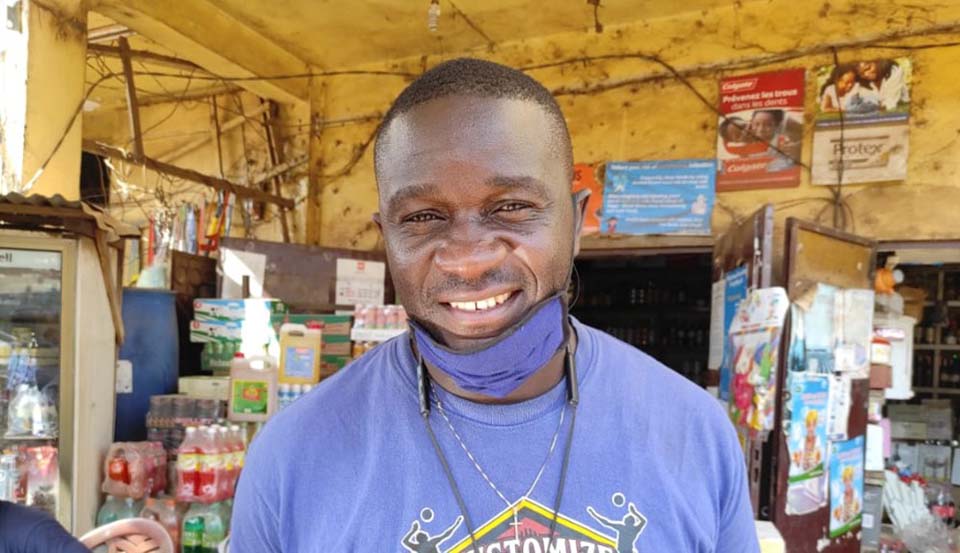 store owner in his shop in Cameroon