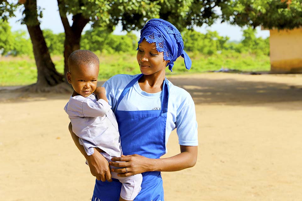 Benin mother holding child