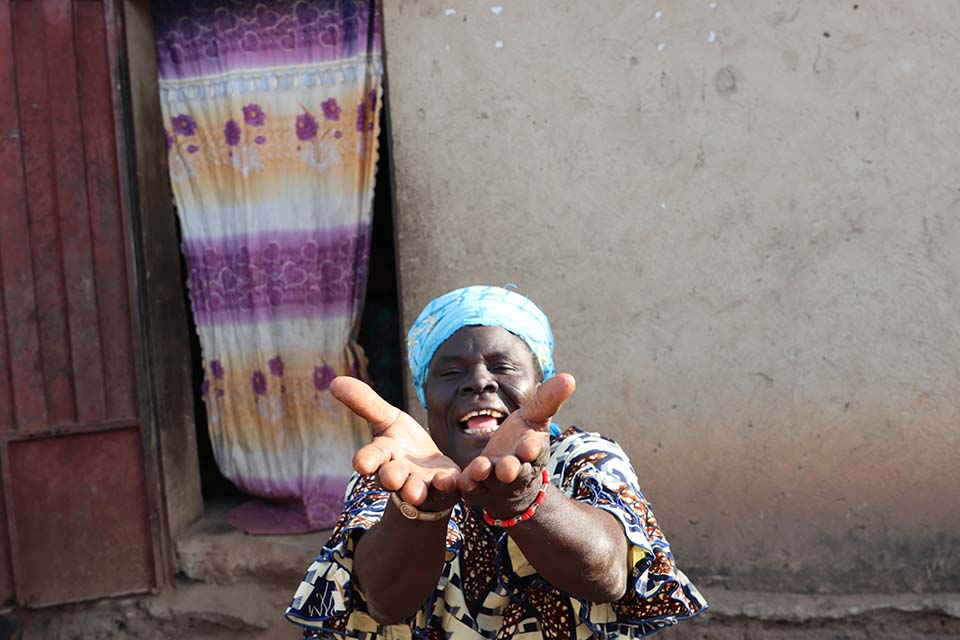 Benin woman with hands outstretched