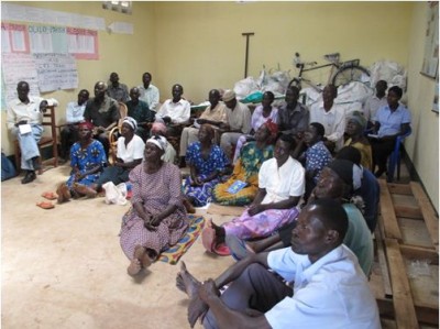 Members of the Barr Orphans, Widowers, and Widows Cooperative Society (BOWW) in their store during a training session led by Farmer-to-Farmer Volunteer Lisa Campion. Copyright Lisa Campion 2014, used with permission.