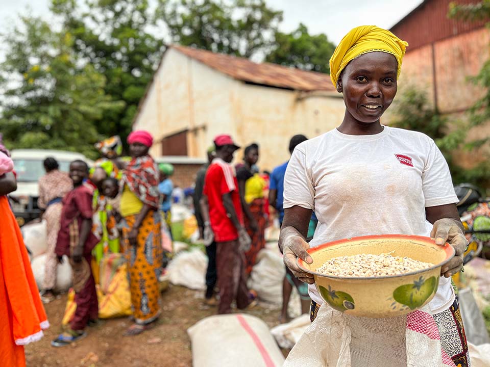 woman carries basket of rice in Central African Republic