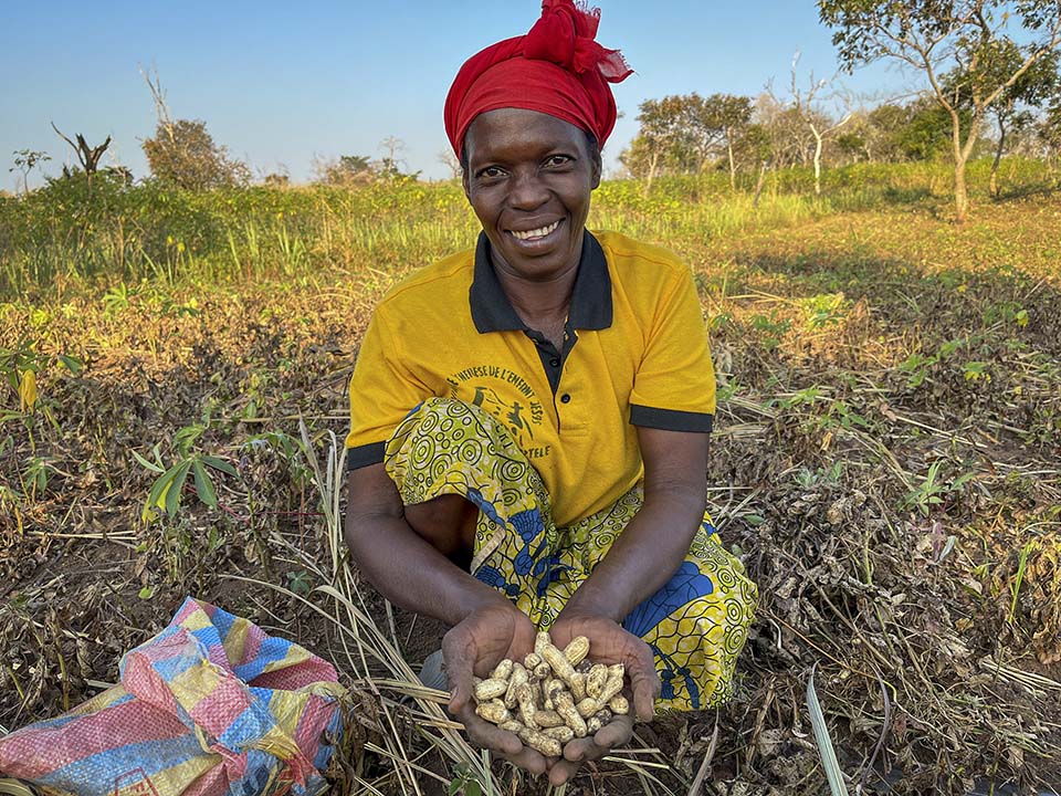 Central African Republic farmer holds peanuts