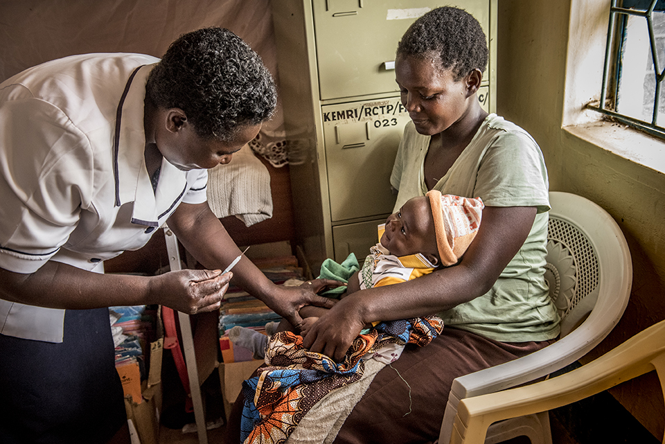 child receives vaccination in Kenya