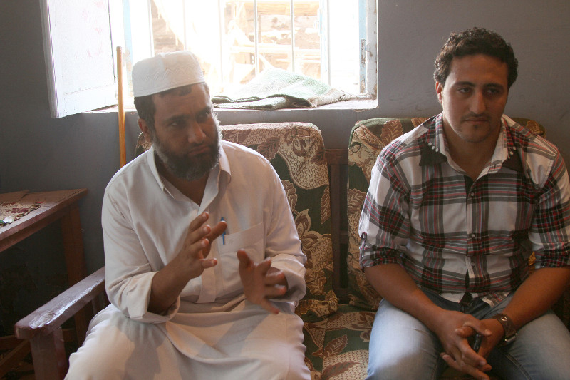 Al Dabiyyah residents Mohamed Abdel Aaty Al Taher, left, and Magdi Adly, a local painter, became good friends while participating in the CRS peacebuilding program TA'ALA. Photo by Nikki Gamer/CRS