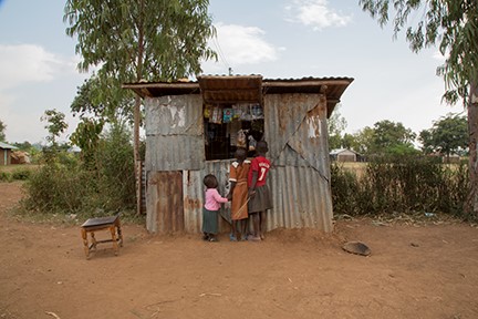Replacing her tin shop with a brick-and-mortar store is one investment Janet Anyango Okeyo plans to make using money she saved through a CRS-supported Savings and Internal Lending Community. Photo by Sara A. Fajardo/CRS