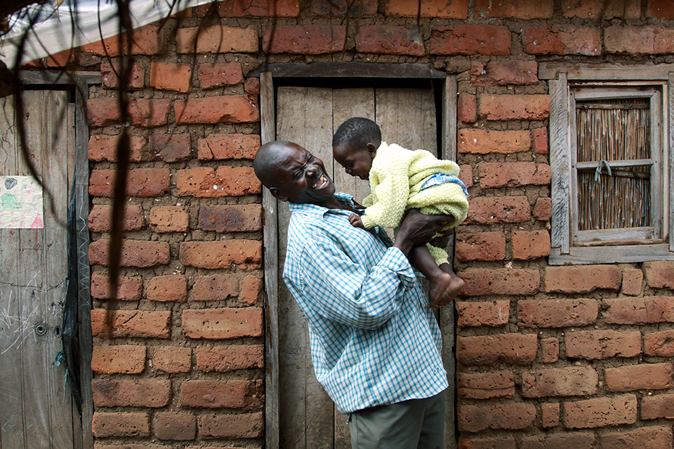 father lifts son in Malawi