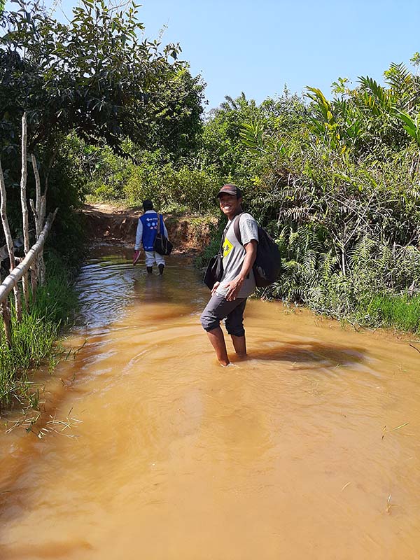 CRS hydrologist stands in waterway