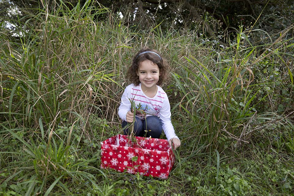 girl with box for Puerto Rican Christmas celebration