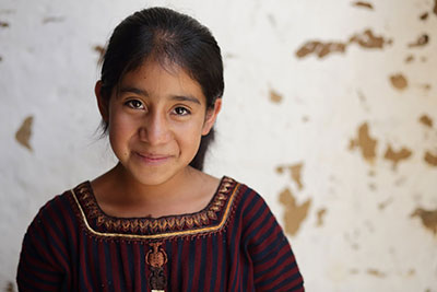 Photo by Silverlight for Thirteen-year-old Heidi Mariela Yuvilis 'Yuvi' Lopez Ixcoteyac used to spend much of her time sewing t-shirts for her family's garment-making business in Guatemala. Now, she will be the first in her family to attend middle school. Photo by Silverlight for
