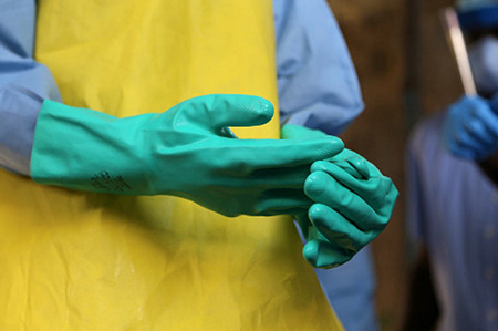 In response to the Ebola outbreak in Guinea, CRS is training more than 3,000 health care workers so they understand when and how to use protective medical equipment. Photo by Michael Stulman/CRS