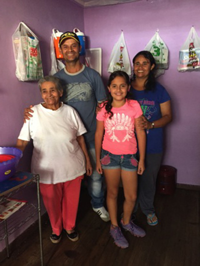 Gustavo, his sister Martha, niece Luisa and mother, Clara, are Colombian refugees living in Ecuador. Photo by Lucy Steinitz/CRS