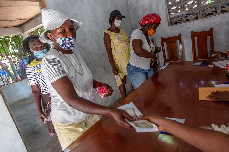 woman packs supplies in Ukraine.