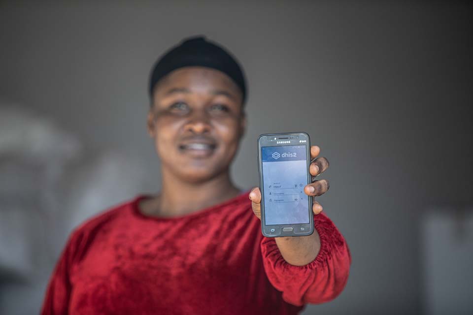 healthcare worker holds smart phone