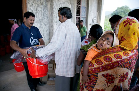 QR code technology has reduced wait times for families who need help after a disaster. Photo by Jennifer Hardy/CRS