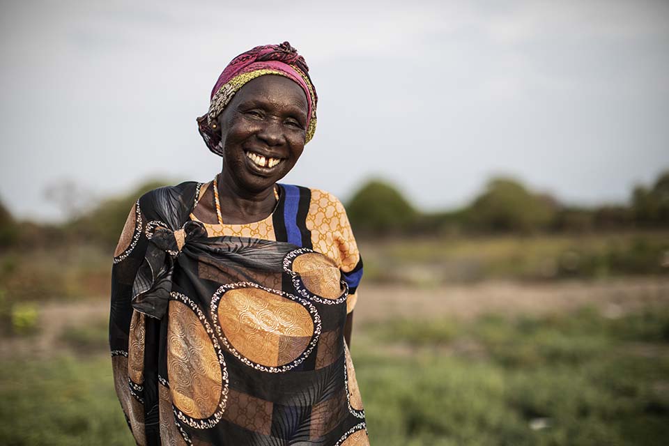 infant and maternal health leader facing camera and smiling in South Sudan