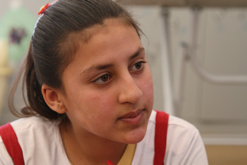 Nariman Chamo, 11, at a CRS child support center outside of Dohuk, northern Iraq, is among thousands of children and families displaced by ISIS. Photo by Kim Pozniak/CRS