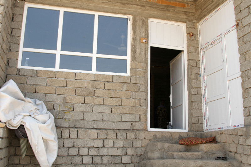 In and around Dohuk, in northern Iraq, CRS and its partner Caritas Iraq are upgrading hundreds of vacant and unfinished buildings that have become homes for displaced Iraqis like Wesal Badel and her family. Photo by Kim Pozniak/CRS