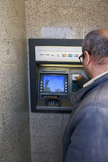Debit cards provide refugees from Syrian conflict with choice and a sense of normalcy. Photo by Maggie Holmesheoran/CRS