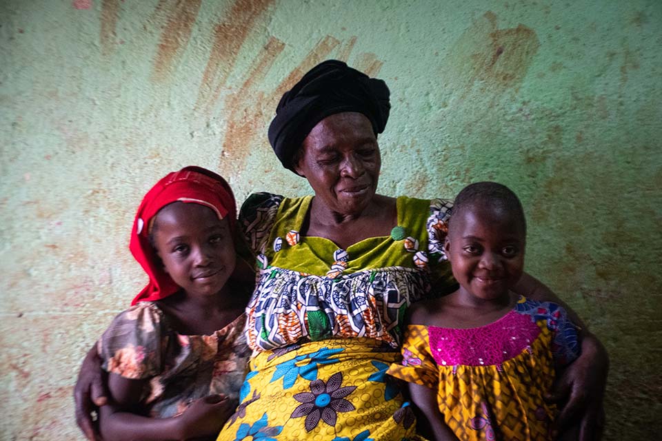 Cameroon woman and two girls facing camera
