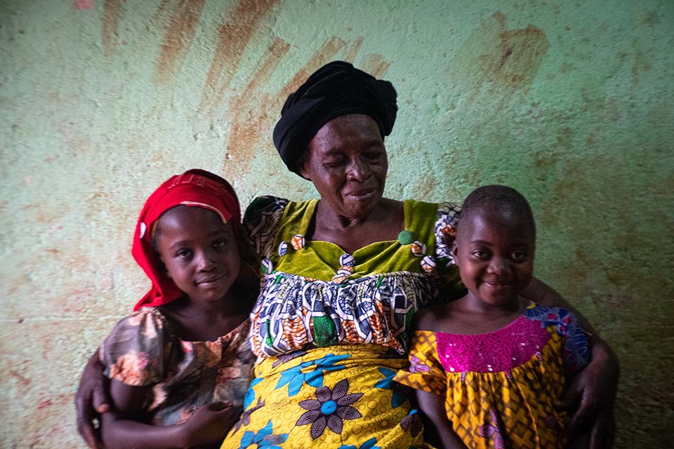 Cameroon woman and two girls facing camera