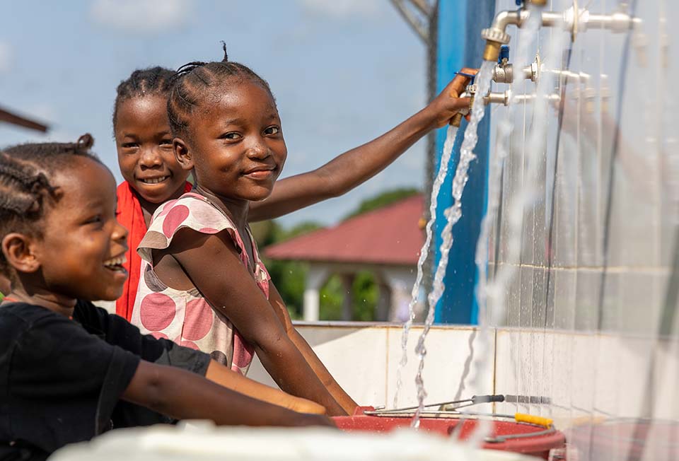 children at water station in Liberia