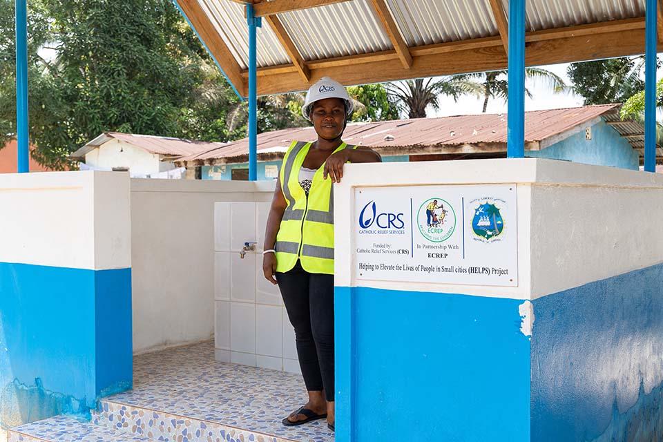 woman at water station in Liberia