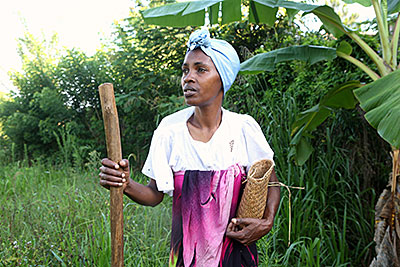 At her family plot in Madagascar, Albertine Sampy prepares to plant corn she purchased at a CRS-sponsored seed fair. Photo by Sara A. Fajardo/CRS