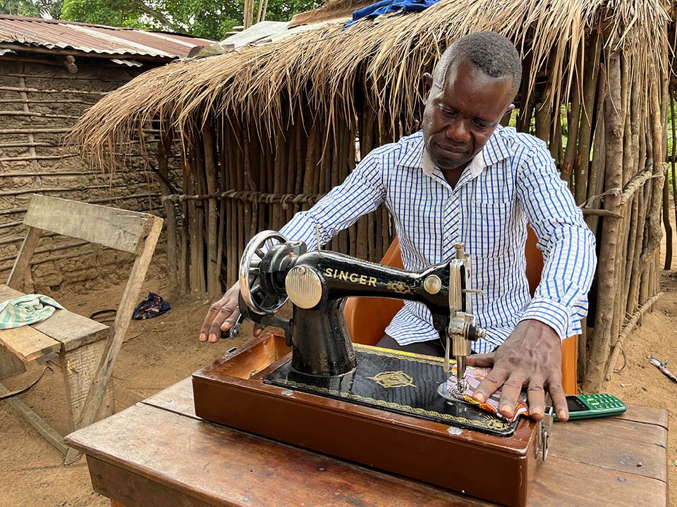 man sewing in Republic of Congo