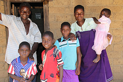 Community educator Mary Biliati, right, teaches mothers in her Malawi village how to cook more nutritious meals for their families. Photo by Jennifer Hardy/CRS