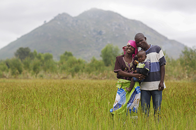 Sarah Gavinala, who lives in Malawi with husband Witinesi and son Bashil, was diagnosed with HIV when she was expecting. She found support through CRS’ IMPACT project. As a result, Bashil has tested negative for HIV. Photo by Sara A. Fajardo/CRS