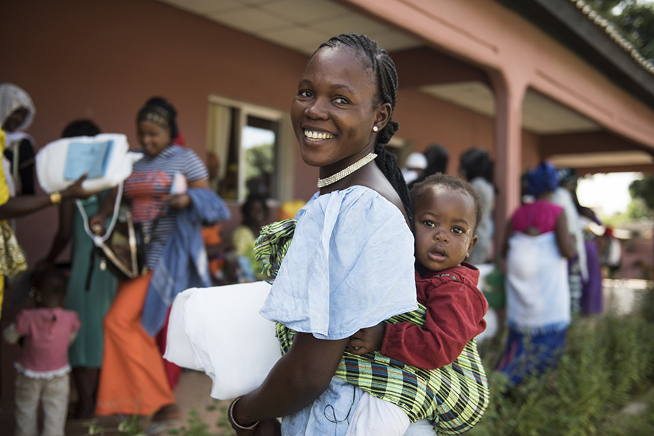 receiving malaria net in the gambia