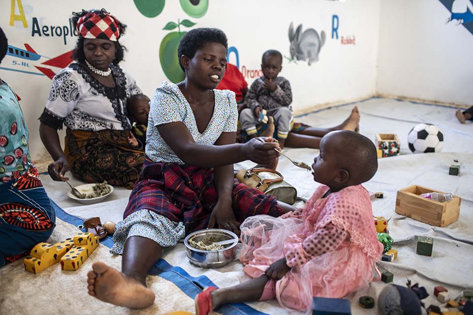 mother feeds her child in Tanzania