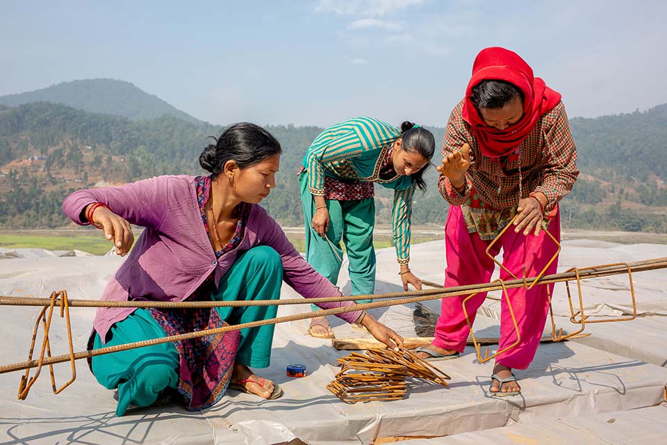 Nepalese women working on home construction