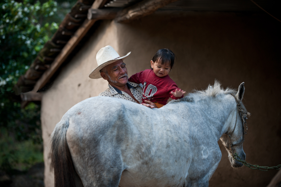 man and child with horse in Nicaragua