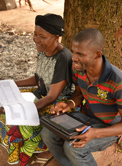 An app helps CRS collect and analyze information rapidly and efficiently from cassava farmers like Mwese Jato. The goal is to document progress and improve services. Photo by Michael Stulman/CRS