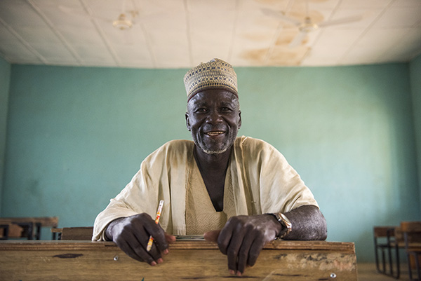 At age 66, Ibrahim Nadashi is learning to read and write in a CRS-supported class in Nigeria. Photo by Michael Stulman/CRS