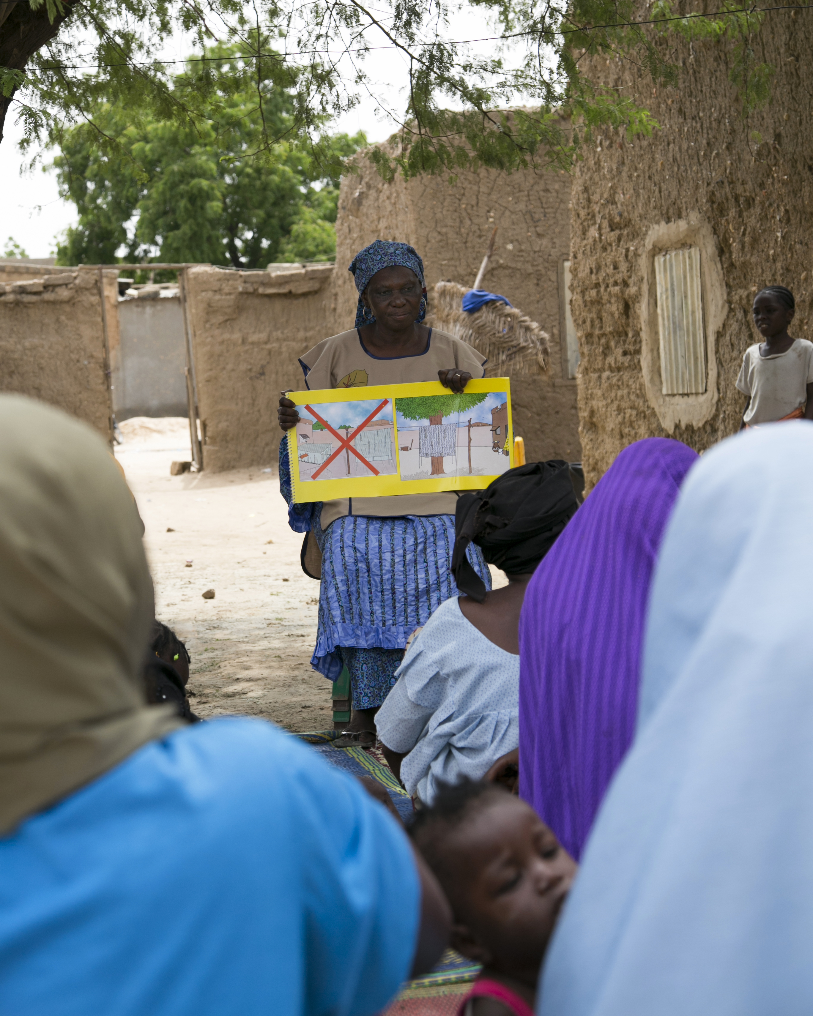 Seydou Fati, a community volunteer in Niger, educates communities about the importance of malaria prevention, including the use of insecticide-treated mosquito nets. Photo by Michael Stulman/CRS