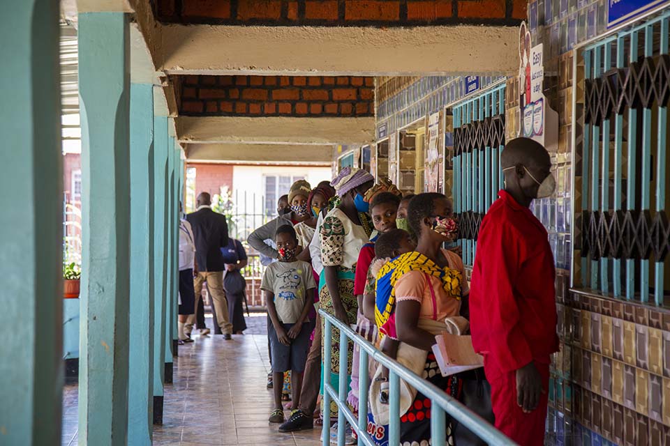patients stand in line in Malawi 