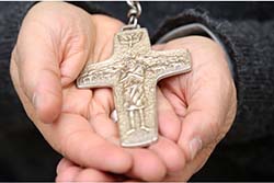 hands holding cross