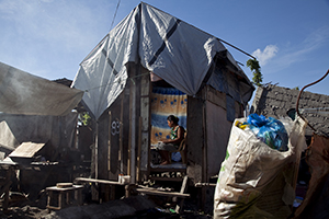 Jihan Refuelo wanted to die when she thought the storm had killed her son, Rangit. Thankfully, her family survived, and she is working to make a better life for them in Tacloban, Philippines. Photo by Laura Elizabeth Pohl for CRS