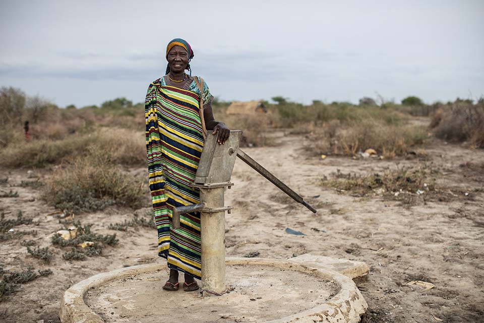 pump mechanic standing near well in South Sudan