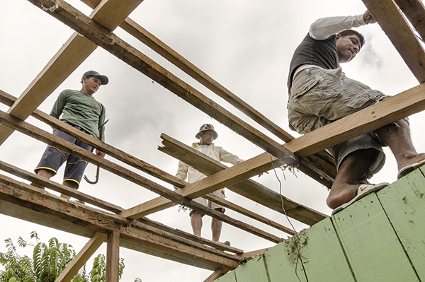 workers rebuild after Eucuador earthquake