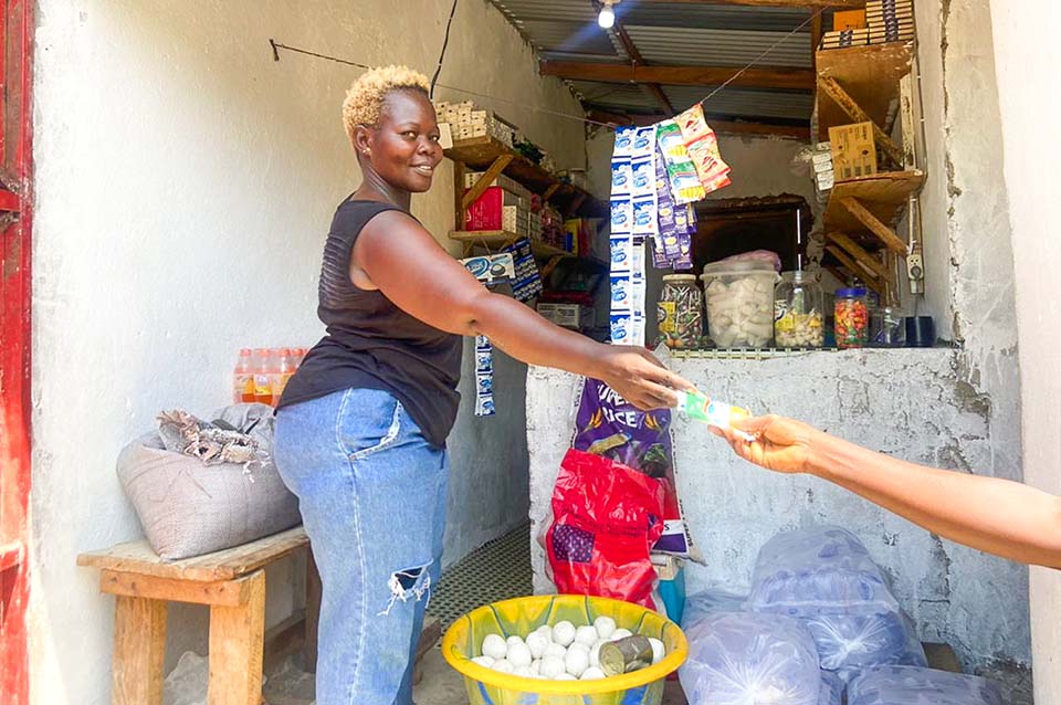 refugee woman tends her shop in Liberia