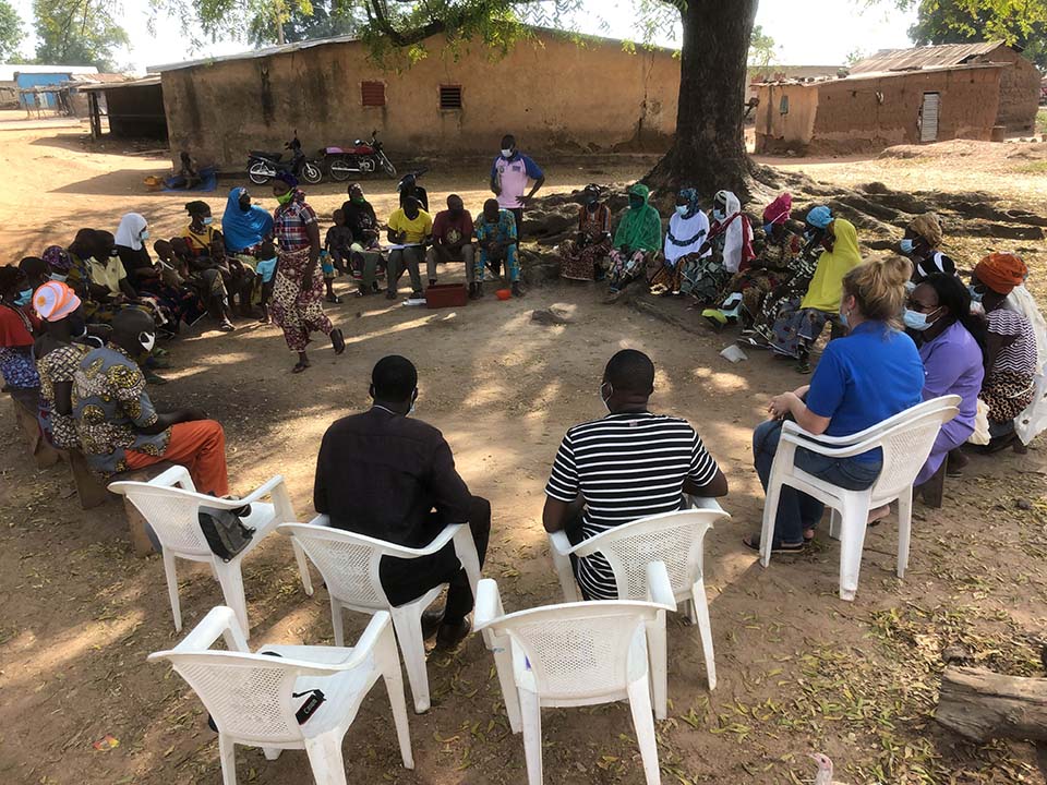 savings group sits in wide circle in Benin