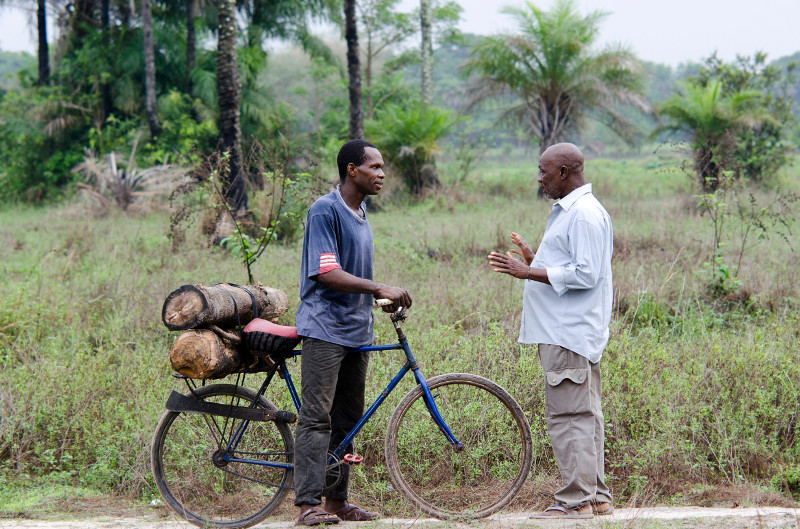 Toumboul Sané, right, prevents a poacher from removing lumber from a forest in the Casamance region of Senegal. Photo by Michael Stulman/CRS