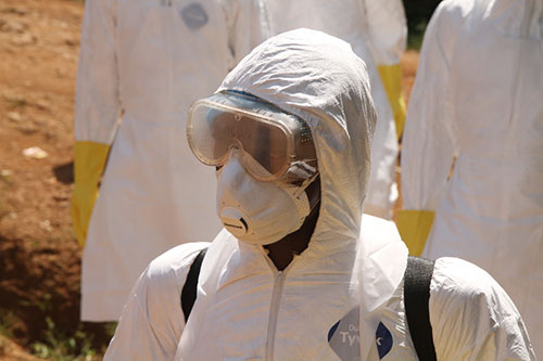 A burial team member in Kabala, Sierra Leone, where CRS is supporting the safe and dignified burials of Ebola victims. Photo by Donal Reilly/CRS