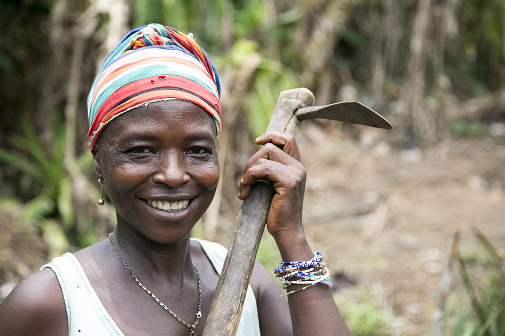 Fudia Lansana is back at work on her farm in Sierra Leone after the Ebola outbreak kept her at home without food for her family. Photo by Michael Stulman/CRS