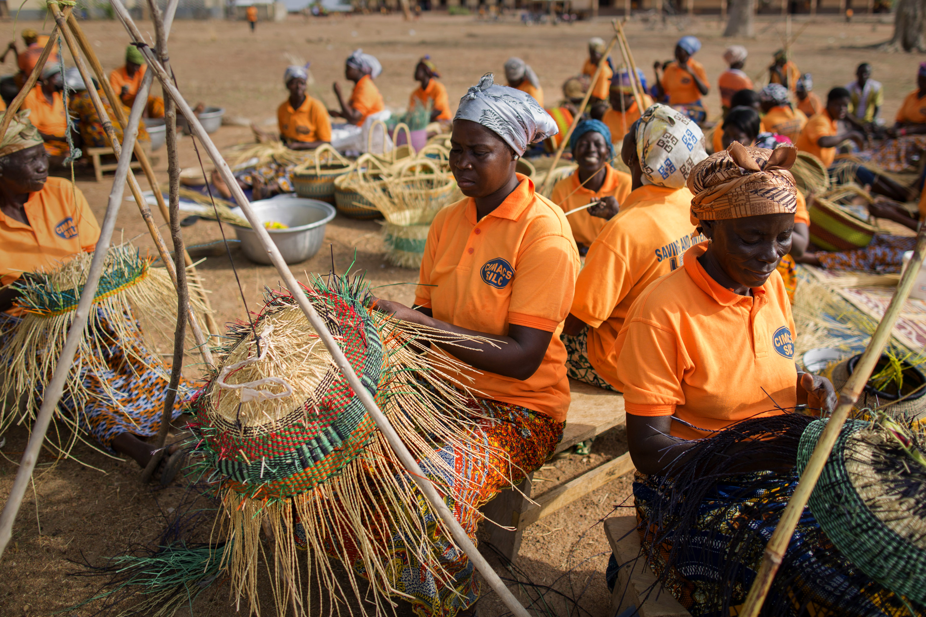 This group of women began weaving straw baskets when weather patterns related to climate change inhibited their abilities to earn a living through farming. Photo by Jake Lyell for CRS This group of women began weaving straw baskets when weather patterns related to climate change inhibited their abilities to earn a living through farming. Photo by Jake Lyell for CRS
