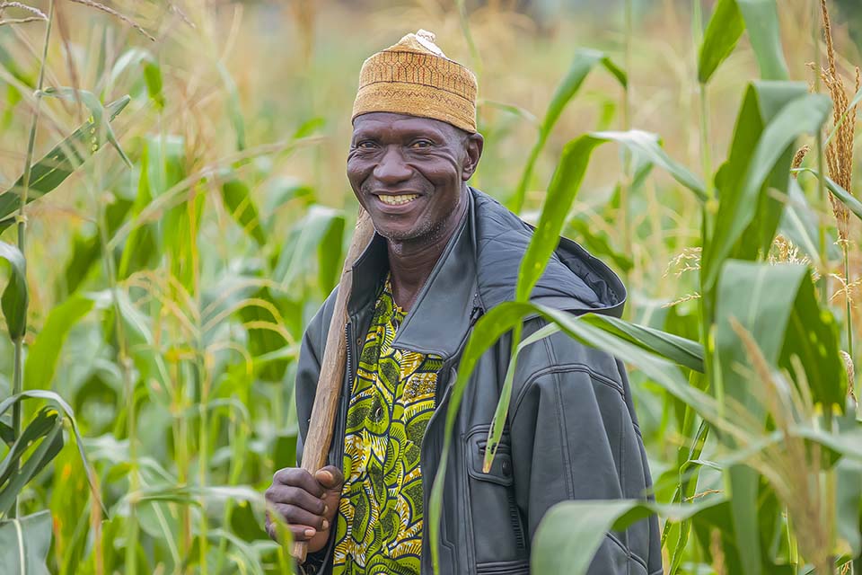 smiling Benin farmer in field